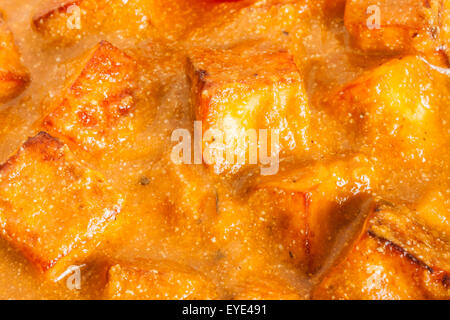 Closeup overhead view of delicious Indian paneer butter masala. It is prepared using paneer (cottage cheese). Stock Photo