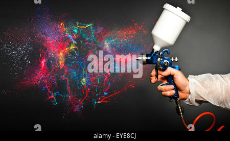 closeup image of hand hold spray gun Stock Photo