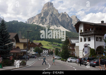 Mount Sassongher (2,665m) in the background of the the Dolomites resort town of Corvara during the summer walking season. Stock Photo