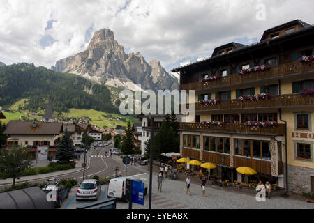 Mount Sassongher (2,665m) in the background of the the Dolomites resort town of Corvara during the summer walking season. Stock Photo