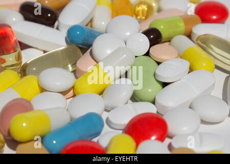many pills, capsules and tablets - pile of medication Stock Photo