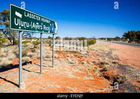 An iconic road sign directing towards Uluru on the Northern Territory, Australia Stock Photo