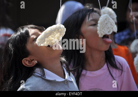 Kerupuk eat race is one of activities of the Indonesian people to celebrate Independence day on August 17 Stock Photo