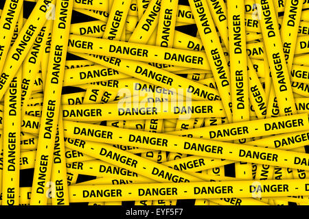 Yellow caution tape strips with text of danger, on black background. Stock Photo