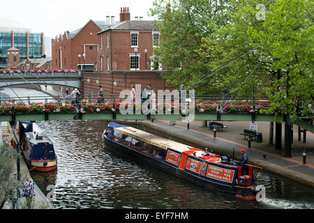 A trip narrowboat on the Birmingham Canal Old Line, Brindley Place, Birmingham, UK Stock Photo