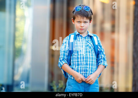 Portrait of cute school boy with backpack Stock Photo