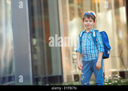 Portrait of cute school boy with backpack Stock Photo