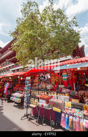 Outside stalls in Singapore's Chinatown district selling tourist souvenirs, purses, scarves and much more. Stock Photo