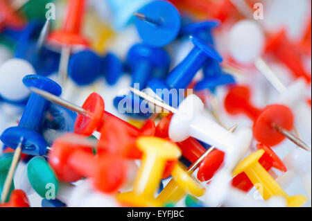 Close-up of a collection of colourful drawing-pins. Stock Photo