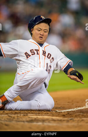 Houston, TX, USA. 28th July, 2015. Houston Astros catcher Hank Conger (16) slides into home to score a run during the 2nd inning of a Major League Baseball game between the Houston Astros and the Los Angeles Angels at Minute Maid Park in Houston, TX. Trask Smith/CSM/Alamy Live News Stock Photo