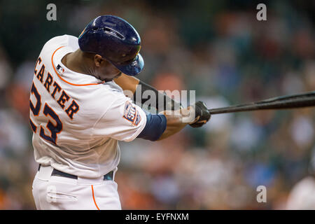 Houston, TX, USA. 28th July, 2015. Houston Astros designated hitter Chris Carter (23) hits a 2 run home run during the 2nd inning of a Major League Baseball game between the Houston Astros and the Los Angeles Angels at Minute Maid Park in Houston, TX. Trask Smith/CSM/Alamy Live News Stock Photo