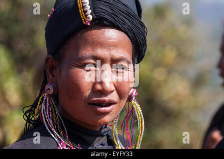 Native woman in typical clothing and headgear from the Ann tribe in a mountain village at Pin Tauk, portrait Stock Photo