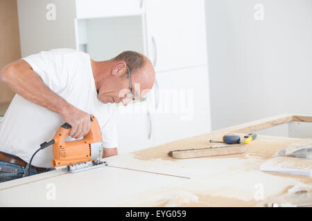 Experienced carpenter working on a project Stock Photo