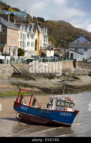 UK, Wales, Gwynedd, Aberdovey, fishing boat on harbour beach at low tide Stock Photo