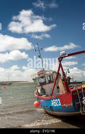 UK, Wales, Gwynedd, Aberdovey, fishing boat on harbour beach at low tide Stock Photo