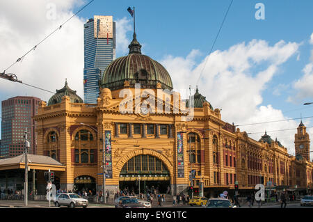 Eureka Tower rises behind Flinders Street Station,  Melbourne's major public transport terminus. Stock Photo