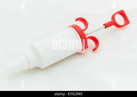 Icing syringe isolated on white background. Stock Photo