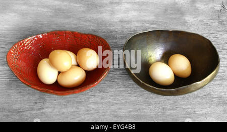 dont put all eggs in one basket proverb representig two trays with eggs shared Stock Photo