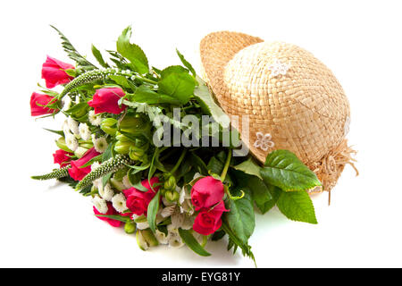 Colorful bouquet with straw hat over white Stock Photo