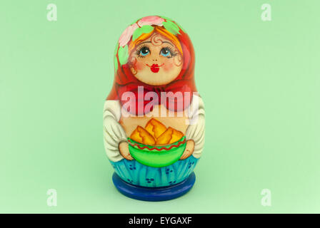 Russian doll matryoshka on green background Stock Photo