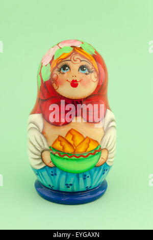 Russian doll matryoshka on green background Stock Photo