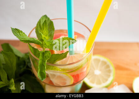 fresh mint on the wood table with sliced lemon and lemonade Stock Photo