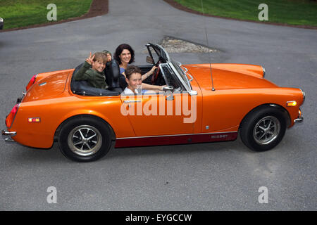 Du Bois, USA, woman and child take a MG Midget Stock Photo