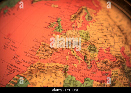 red light world globe illuminated from within with closeup on Europe Stock Photo
