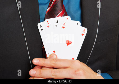 Business man holding four aces cards in his hands Stock Photo