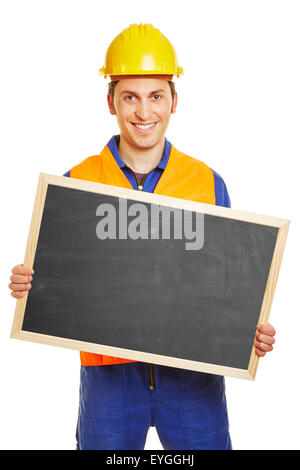 Smiling blue collar worker holding an empty blackboard Stock Photo