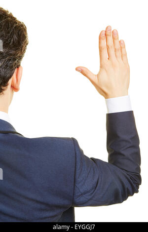 Politician from behind lifting his hand for an oath Stock Photo