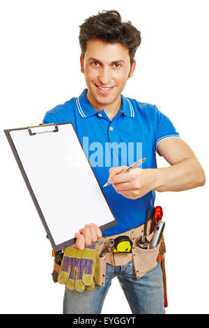 Smiling craftsman with pen and paper on a clipboard Stock Photo