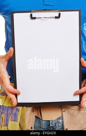 Craftsman with empty white clipboard in his hands Stock Photo