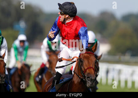 Iffezheim, Germany, Jockey Filip Minarik cheers on Ivan Howe after winning the Longines - Grosser Preis von Baden Stock Photo