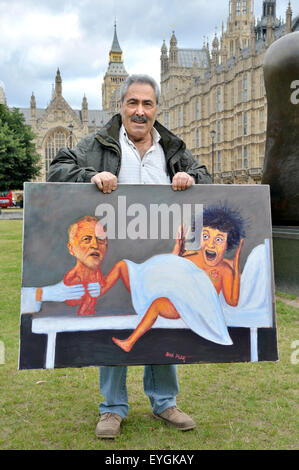 Westminster, London, UK. 29th July, 2015. Political cartoonist Kaya Mar unveils his latest work - featuring a rather surprised Labour Party giving birth to Jeremy Corbyn - outside Parliament Credit:  PjrNews/Alamy Live News Stock Photo