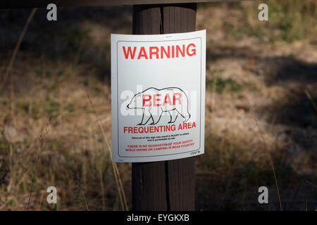 A warning sign in Yellowstone National Park to alert visitors to the presence of a bear in the area Stock Photo