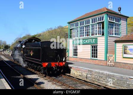 Corfe Caste station on the Swanage Heritage Railway. Stream train with signal box, Dorset, UK. Stock Photo