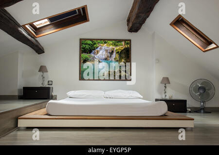 interior view of a bedroom in the attic room Stock Photo