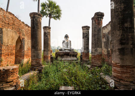 The ruins of a temple and Buddha. Republic of the Union of Myanmar (Burma), Mandalay, Inwa, Stock Photo