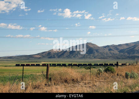 Freight train on the high desert Stock Photo