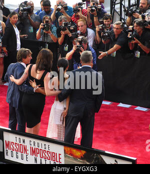 New York, NY, USA. 27th July, 2015. July 27, 2015 - New York, New York, USA - Tom Cruise, left, Ireland Baldwin, Hilaria Thomas Baldwin and Alec Baldwin attend the premiere of the film Mission Impossible-Rogue Nation in New York's Times Square. © KC Alfred/ZUMA Wire/Alamy Live News Stock Photo