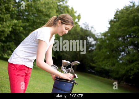 young woman playing golf Stock Photo