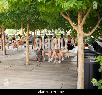New York, USA. 29th July, 2015. Visitors to the High Line Park in New York escape the heat in the shade on Wednesday, July 29, 2015. New York is enduring day two of over 90 F temperatures with no relief for Thursday. Three days of over 90 F temps becomes an official heat wave. Credit:  Richard Levine/Alamy Live News Stock Photo