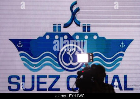 Ismailia, Egypt. 29th July, 2015. A cameraman takes video clips on a press conference about the new Suez Canal in Ismailia, a port city in Egypt, on July 29, 2015. The dredging work of Egypt's 'New Suez Canal' has been completed and the waterway is ready as well as safe for huge ship navigation, Mohab Memish, head of the Suez Canal Authority (SCA), told reporters in a press conference Wednesday. © Pan Chaoyue/Xinhua/Alamy Live News Stock Photo