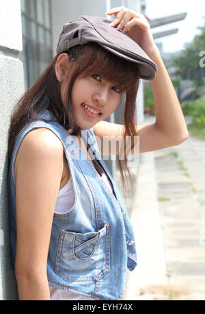 image of portrait young asian woman in jeans fashion outdoor Stock Photo