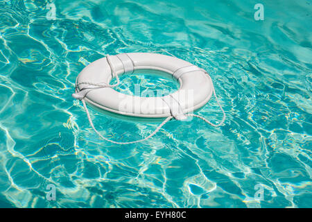 Life buoy in swimming pool life saver Stock Photo