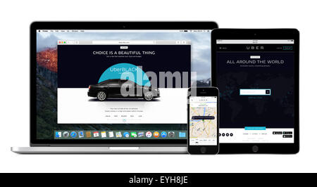 Varna, Bulgaria - February 02, 2015: Uber app on Apple iPhone and desktop version of Uber on Macbook Pro and iPad screens. Stock Photo