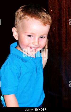 Portrait of a happy child at the door Stock Photo