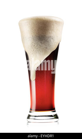 Tall glass of dark beer with foam isolated on white background Stock Photo