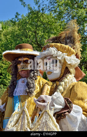 MOUSCRON, BELGIUM-JUNE 06, 2015: Participants of defile in costumes of Carnival de Venice in Parc Communal during 6 edition of V Stock Photo